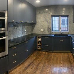 Design Surfaces Tile and Stone - Countertop, soapstone, dolomite, navy cabinets