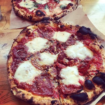 Cart-Driver - Peppers pizza (pepperoni and peppers) in front, daisy pizza (margherita) in the back. - Pizza Near Me - Denver, Colorado