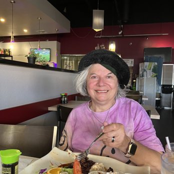 Akaihana Sushi & Grill - Diana enjoying her ice tea & steak teriyaki - Sushi Bars Near Me - Phoenix, Arizona