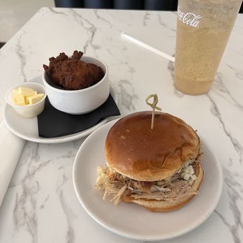 Black Iris Cafe - Pulled pork Sammy, hush puppies - Salad Near Me - Tucson, Arizona Black Iris Cafe - Pulled pork Sammy, hush puppies - Salad Near Me - Tucson, Arizona
