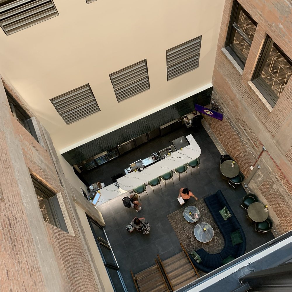 Hotel Indigo Omaha Downtown - Bar downstairs; all floors are open in the middle to see the atrium - Venues & Event Spaces Near Me - Omaha, Nebraska Hotel Indigo Omaha Downtown - Bar downstairs; all floors are open in the middle to see the atrium - Venues & Event Spaces Near Me - Omaha, Nebraska