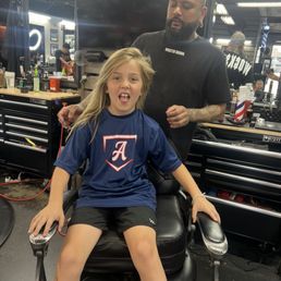 Shmack is his name cutting great hair is the game . Shmack is his name cutting great hair is the game .