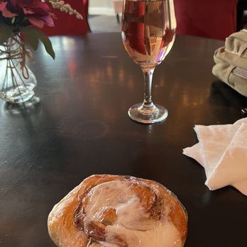Antoinette's Garden - a glass of wine and a pastry on a table - Wine Bars Near Me - Leonardtown, Maryland