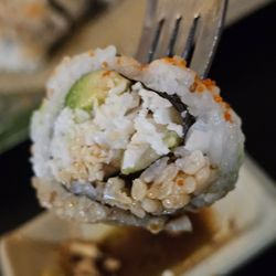Wasabi's - A fork with a piece of the California Roll.