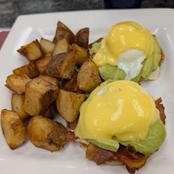 Buppa’s Breakfast - Avacado and bacon Benedict with home fries