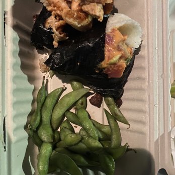 Oori Triangles - Spicy Tuna on the right and grilled salmon on the left. - Japanese Near Me - Albany, California Oori Triangles - Spicy Tuna on the right and grilled salmon on the left. - Japanese Near Me - Albany, California
