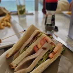 Quarterdeck Restaurants - Club Sandwich, on hard white bread as the only option, poor quality turkey, not much meat. Not worth the money