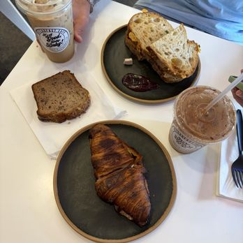 Steadfast Cafe - Brad's Shaken Espresso, honey cinnamon latte, banana bread, bbq chx melt, ham and cheese croissant (dark because i asked for extra toasty) - Coffee & Tea Near Me - Huntington Beach, California Steadfast Cafe - Brad's Shaken Espresso, honey cinnamon latte, banana bread, bbq chx melt, ham and cheese croissant (dark because i asked for extra toasty) - Coffee & Tea Near Me - Huntington Beach, California