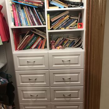 Creative Closets & Storage - a bookcase full of books - General Contractors Near Me