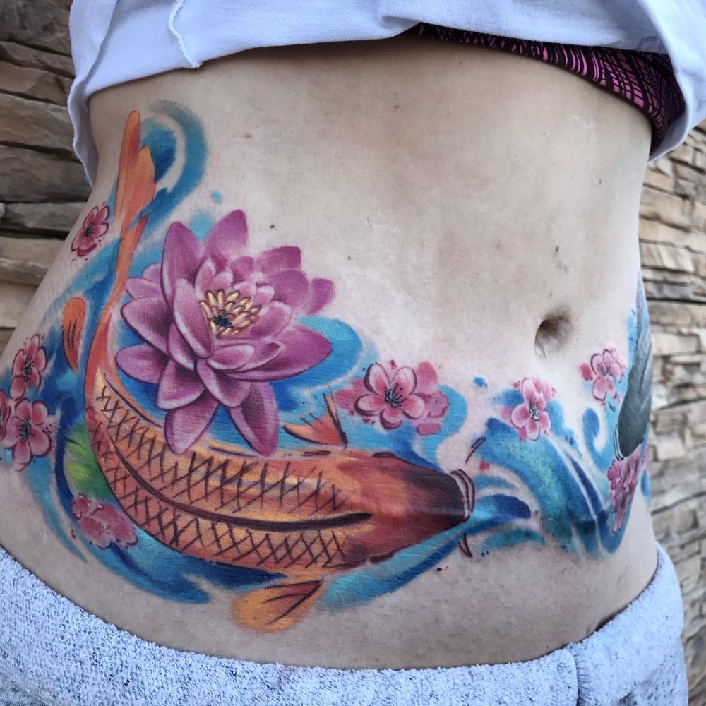 Revolt Tattoos - Koi fish and flowers in watercolor to cover my tt scar. I am soooo happy with it!!! - Tattoo Near Me - Las Vegas, Nevada