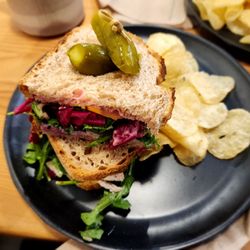 The Colombian Coffee Bar and Roastery - Roasted Turkey Sandwich for $13.00 in 2023. Turkey, cheddar cheese, pickled cabbage, arugula, cranberry mayo, kettle chips.. .