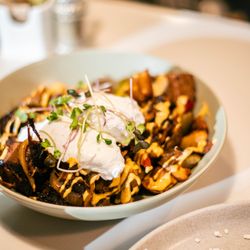 Roasted Nomad - The Brandon Brisket!
Cubed hashbrowns, topped with BBQ brisket burnt ends, onions and peppers, spicy aioli and two soft poached eggs!