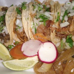 Taqueria La Chiva - Asada, al pastor, and two carnitas tacos.