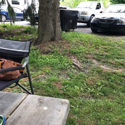 a picnic table with a backpack on it