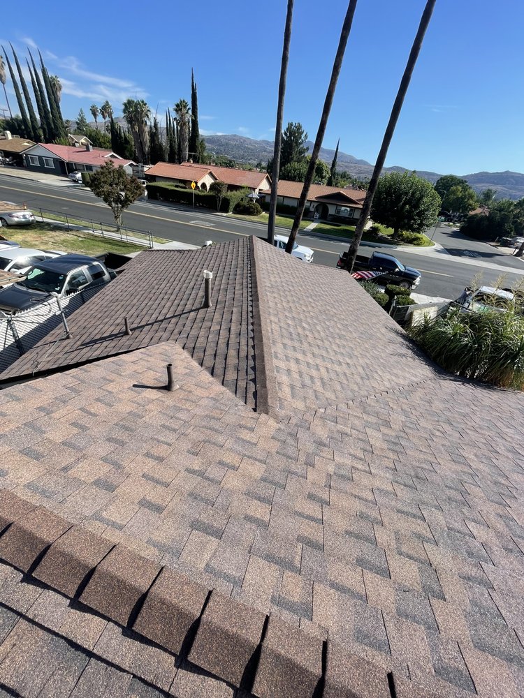 Slide of EZ Roof Repairs
