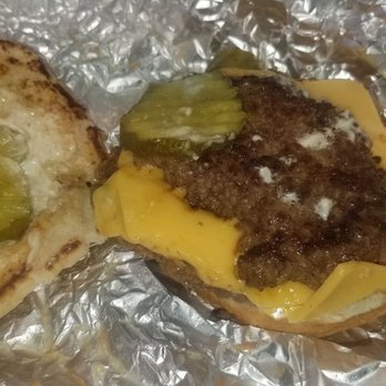Five Guys - Would you pay 9 bucks for this cheeseburger??  No bites were taken before this photo!  Half of a patty on top of a double. - Burgers Near Me - Normal, Illinois