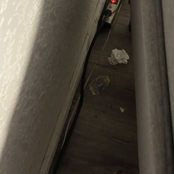 Scandinavian Cleaning - Paper underneath the chair that she completely missed - Home Cleaning Near Me