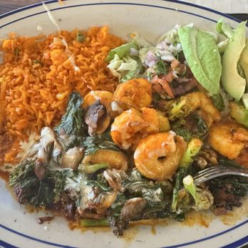 El Mezcal Mexican Restaurant Mount Dora - This rice is rich with saffron, tasty. Shrimp with mushrooms and spinach with aside of avocados Mouth watering. - Mexican Near Me - Mt Dora, Florida El Mezcal Mexican Restaurant Mount Dora - This rice is rich with saffron, tasty. Shrimp with mushrooms and spinach with aside of avocados Mouth watering. - Mexican Near Me - Mt Dora, Florida