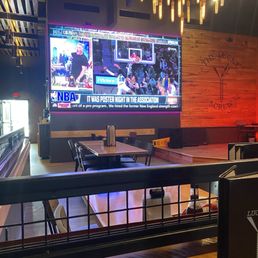 Big open area with a big screen television, great for watching sporting events.