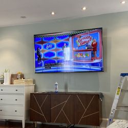 1 Solution AV - 75 inch tv mounted to stucco wall. He only used 4 bolts and is on there incredibly strong!
