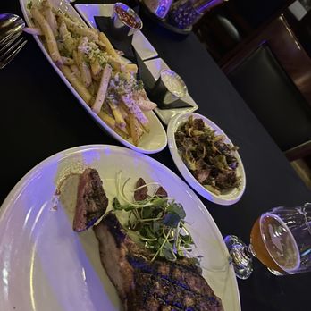 VAULT - Pork Chop, small sample of Wife's filet, vault fries, and Brussels sprouts - New American Near Me - Hot Springs, Arkansas VAULT - Pork Chop, small sample of Wife's filet, vault fries, and Brussels sprouts - New American Near Me - Hot Springs, Arkansas