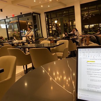 For Five Coffee Roasters - a laptop on a table - Coffee & Tea Near Me - Garden City, New York For Five Coffee Roasters - a laptop on a table - Coffee & Tea Near Me - Garden City, New York