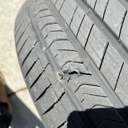 the blown brand-new tire (5days old) that the dealer manager said it was a cut or damage due to some sharp object and refused to replace it.