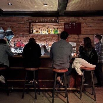 Kiesling - a group of people sitting at a bar - Cocktail Bars Near Me - Detroit, Michigan Kiesling - a group of people sitting at a bar - Cocktail Bars Near Me - Detroit, Michigan