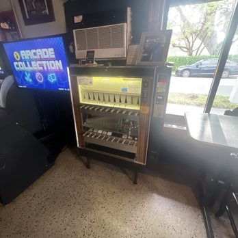 Wayside Inn - Old school cigarettes machine - Dive Bars Near Me - Dania, Florida