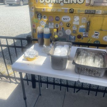 Chirba Chirba Dumpling - Condiment set up. The spicy bean is in the cup under the foil. Excellent. - Chinese Near Me - Durham, North Carolina