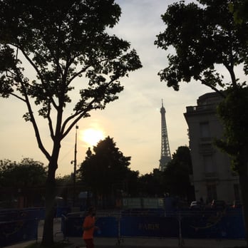 La Tour Eiffel - Peaking above the trees as we near the base of the tower - Landmarks & Historical Buildings Near Me - Paris, 75