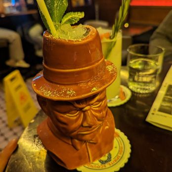 Cahoots Bar - The Winston Churchill, served in a Winston Churchill Tiki. Tastes like a fruit roll up. Would recommend. - Bars Near Me - Soho, XGL