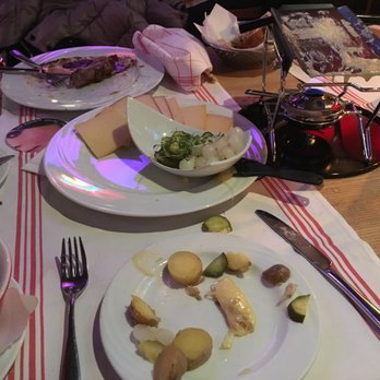 Zunfthausrestaurant Pfistern - Raclette, the heating rack is maybe 100g in weight? It shifts around like it's made of plastic. Surprised this place hasn't burned down yet. - Swiss Food Near Me - Luzern, LU