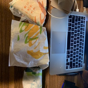 Taco Bell - an open laptop computer on a wooden table - Fast Food Near Me - Chino Hills, California
