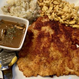 Schnitzel, Spaetzel, potato salad, mushroom gravy, and a interesting little lemon squeezer