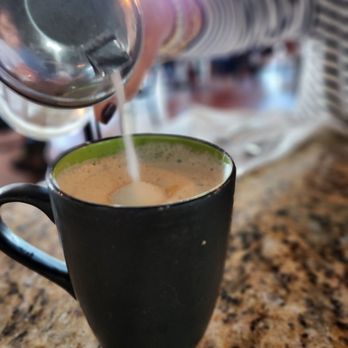 Sage Biscuit Cafe - Downtown - a person pouring a cup of coffee - Breakfast & Brunch Near Me - Bradenton, Florida Sage Biscuit Cafe - Downtown - a person pouring a cup of coffee - Breakfast & Brunch Near Me - Bradenton, Florida