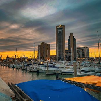 The Mariner - boats docked in a harbor at sunset - Tapas/Small Plates Near Me - Corpus Christi, Texas The Mariner - boats docked in a harbor at sunset - Tapas/Small Plates Near Me - Corpus Christi, Texas