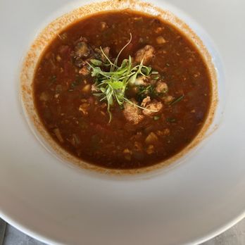 Mignonette - Red Clam Chowder with fried Conch on top! - New American Near Me - Miami, Florida