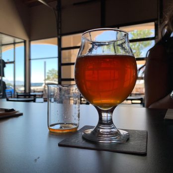 Brew Lab 101 - Sassy brunette and view of outside seating - Breweries Near Me - Rio Rancho, New Mexico