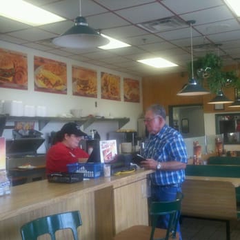 Huddle House - a man and a woman in a restaurant - Diners Near Me - Cochran, Georgia