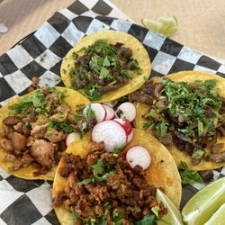 Boss Man Tacos Burritos & More - Pastor, steak, chicken, & chorizo tacos with no onion at my request.