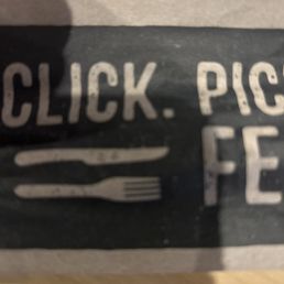 a close up of a sign with a fork and knife a close up of a sign with a fork and knife