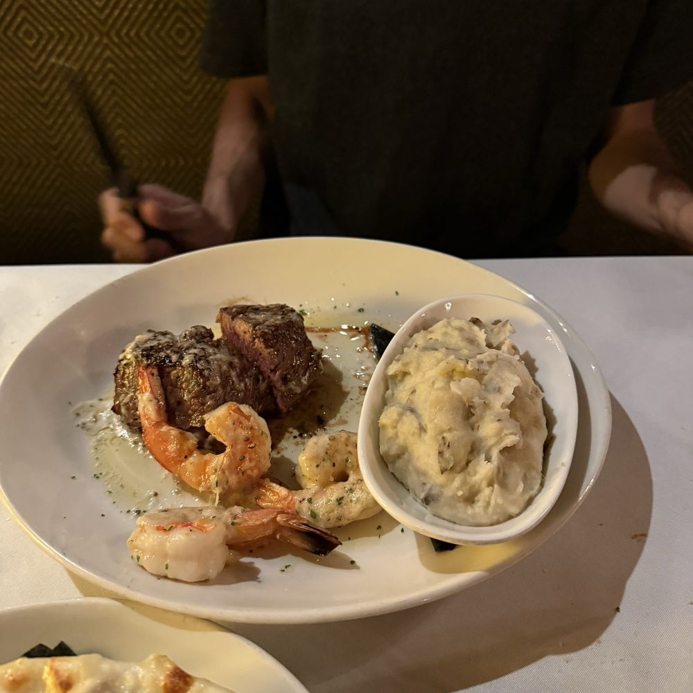 Sullivan's Steakhouse - 8oz NY strip with garlic buttered shrimp topping and garlic mashed potatoes - Steakhouses Near Me - Naperville, Illinois Sullivan's Steakhouse - 8oz NY strip with garlic buttered shrimp topping and garlic mashed potatoes - Steakhouses Near Me - Naperville, Illinois
