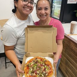 Mozza-Mia cheese pizza with added bell peppers, salami and mushrooms! Mozza-Mia cheese pizza with added bell peppers, salami and mushrooms!