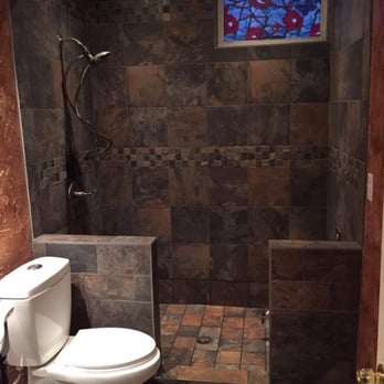 Platinum Bathroom - a toilet and shower with a stained glass window - General Contractors Near Me - Eagle, Nebraska Platinum Bathroom - a toilet and shower with a stained glass window - General Contractors Near Me - Eagle, Nebraska