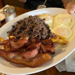 Cuban congri Moro, bacon, sunny side eggs, french fries