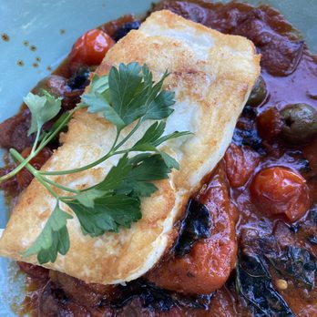 Luna Red - Pacific Halibut Delicious! Has tomato sauce with Spanish green olives and polenta cake - New American Near Me - San Luis Obispo, California Luna Red - Pacific Halibut Delicious! Has tomato sauce with Spanish green olives and polenta cake - New American Near Me - San Luis Obispo, California