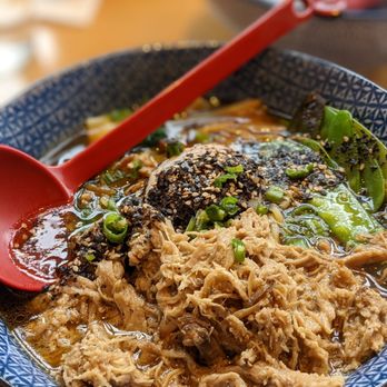 Boke Bowl - a closeup of a bowl of food with a red spoon - Ramen Near Me - Portland, Oregon Boke Bowl - a closeup of a bowl of food with a red spoon - Ramen Near Me - Portland, Oregon