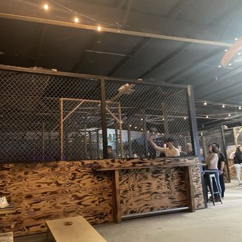 The Axe Lair - different lanes (they have stuff to do while you wait for your lane like corn hold and jenga etc) - Axe Throwing Near Me - Upland, California