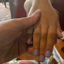 Eden Nails & Spa V - Nail polish on the skin as well nails not shaped correctly.